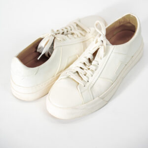 This leather sneaker stands out for its clean lines and understated elegance. Crafted from soft white leather, it features a sleek silhouette enhanced by geometric side details and a matching-tone sole for a modern look. Versatile and comfortable, it is the perfect choice for elevating casual, smart-casual, and refined everyday outfits.
